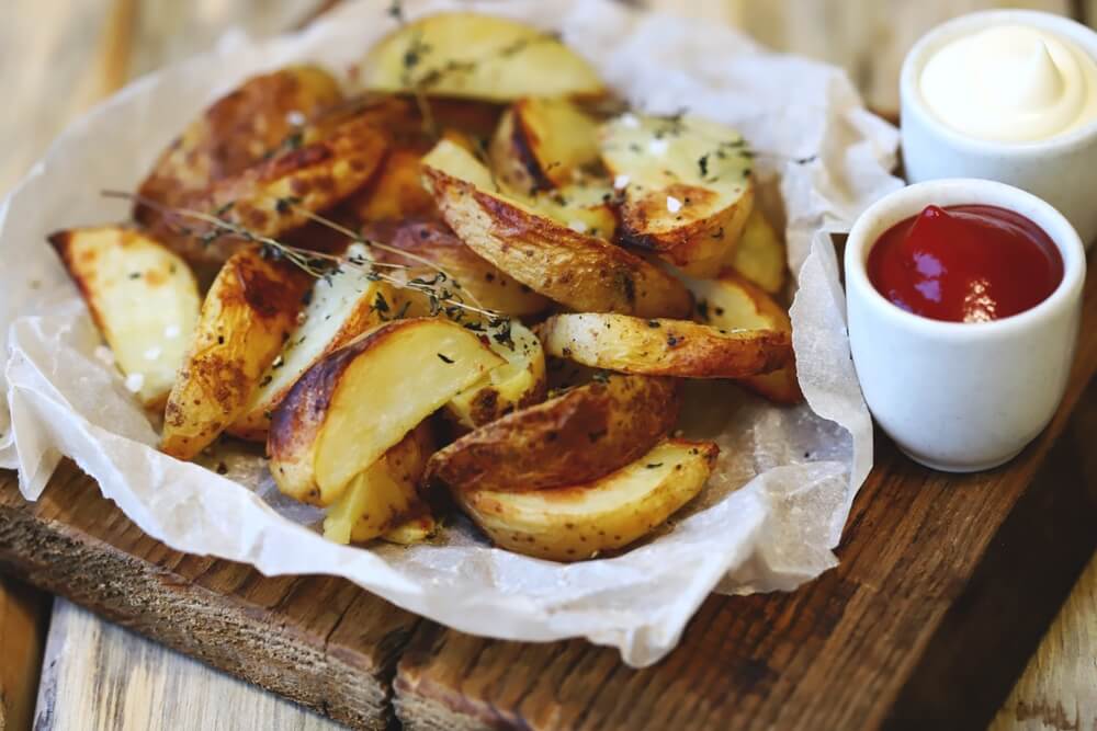 Potato chips with oval shape cute beautiful present with mayonnaise and ketchup